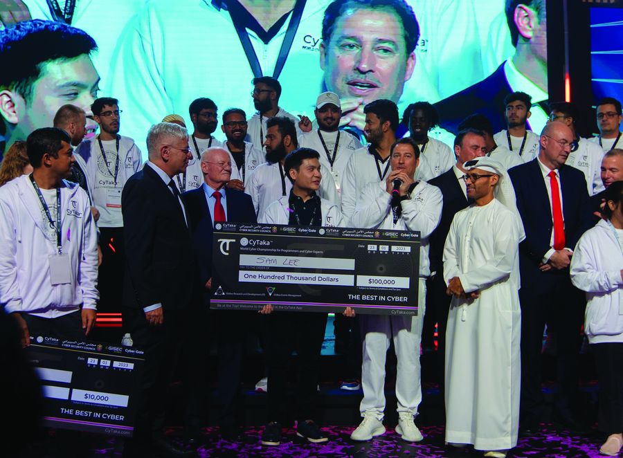 Sam Lee, (Malaysia) a senior security engineer at Amazon Web Services USA, won 1st place prize of $100,000. Pictured with him on the stage (from right to left) H.E. Dr. Al Kuwaiti, Doron Amir, Danny Yaron and Amir Hayek plus other competitors who competed in Round 1 of the World Cyber Championship in Dubai | Photo by Yossi Aloni
