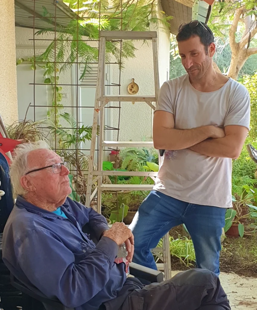 Itzik Shmuli with Nathan Bahat, one of the founders of Nir Oz, on the day he returned to the kibbutz | Photo: Elad Samocha